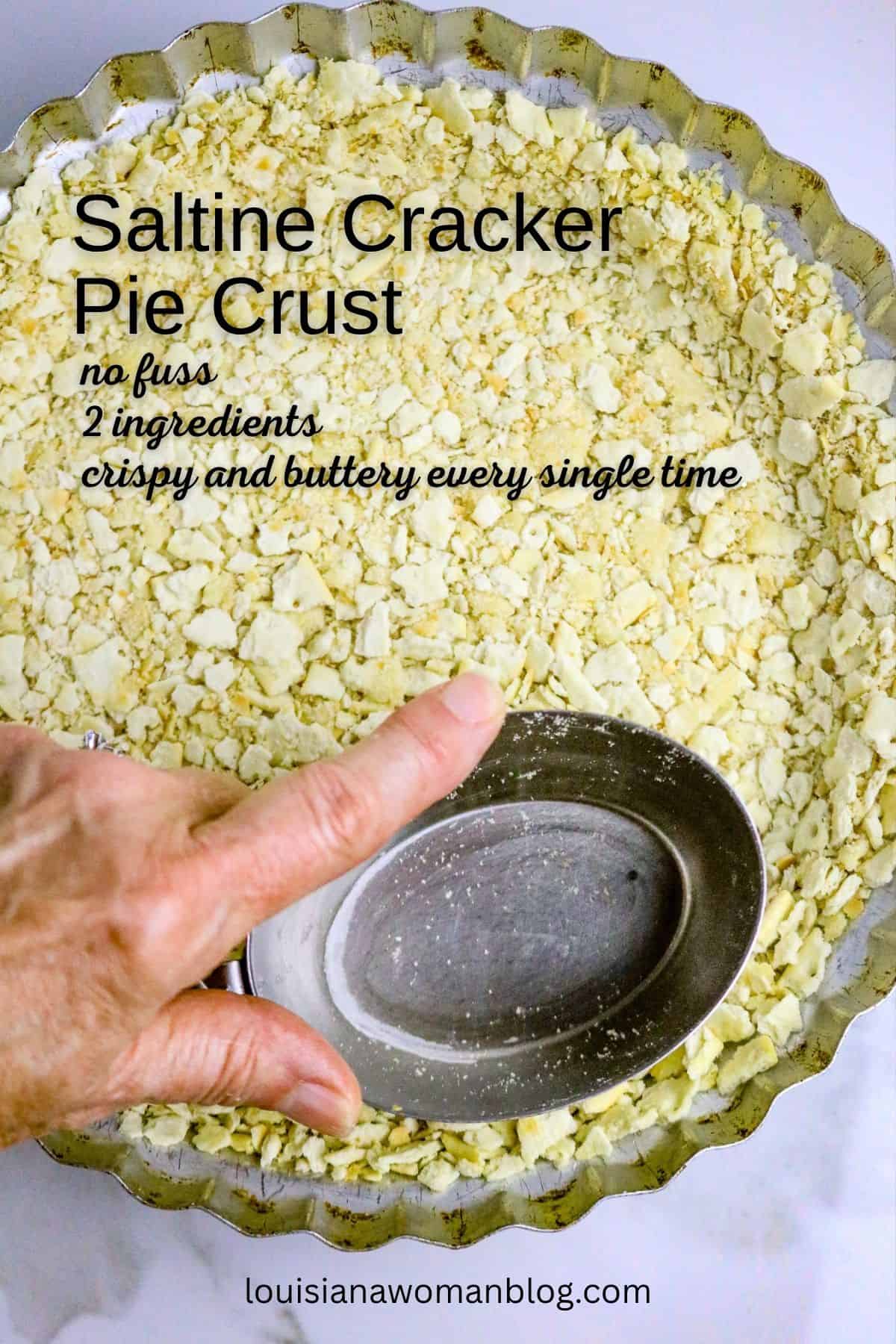 A Pinterest Pin with a pie crust and a hand pressing a cracker crust with a silver measuring cup on the edges of the pie plate.