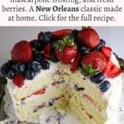 Pinterest of the Vanila Gentilly cake. a white cake covered with fresh berries.